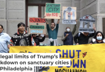 Immigrant rights advocates call on Philadelphia officials to strengthen the city’s sanctuary policies at a rally on Dec. 10, 2024. Manuel Vasquez/Juntos, CC BY-NC-SA